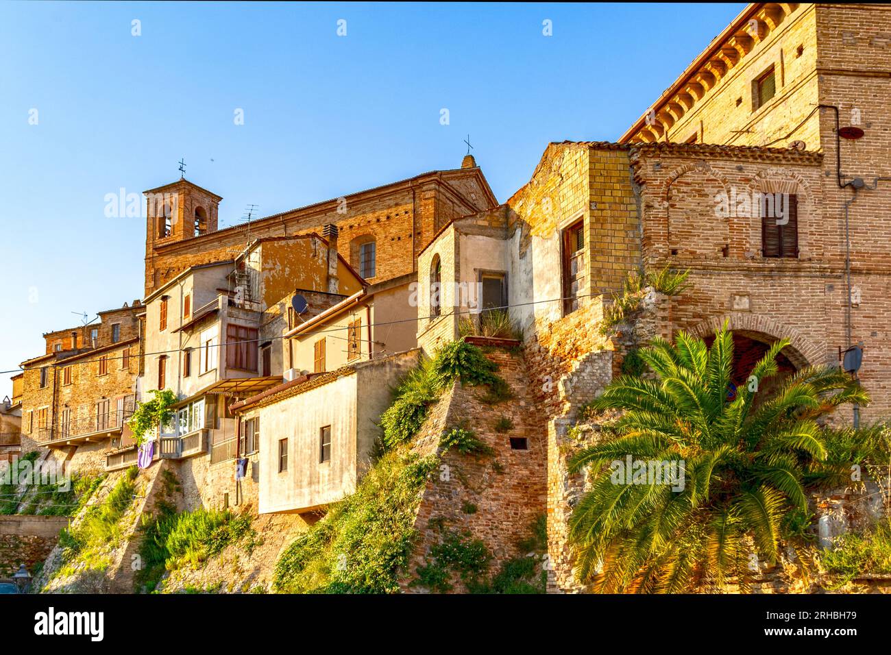 Massignano village, urban lanscape in Italy, Marche, church and old houses Stock Photo