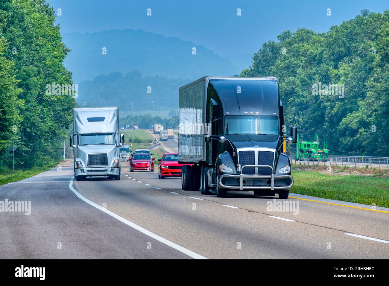 Horizontal shot of mixed traffic on a rural section of a Tennessee interstate highway. Stock Photo