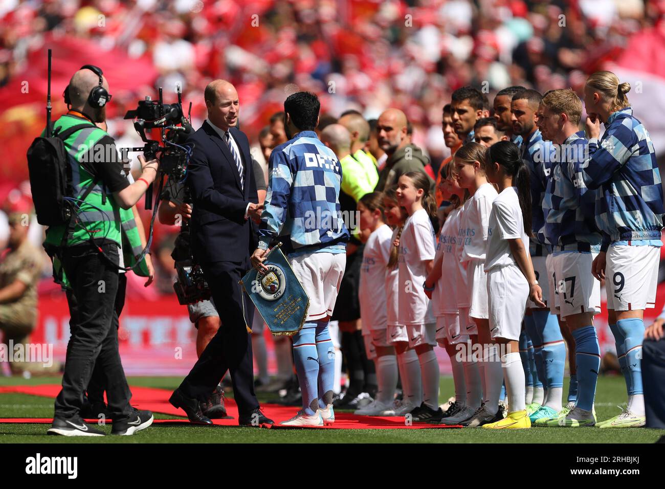 William, Prince of Wales greets Ilkay Gundogan of Manchester City