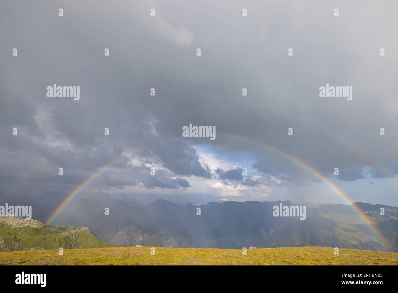 What a wonderful rainbow at the horizon. Beautiful colors. Epic view. Stock Photo