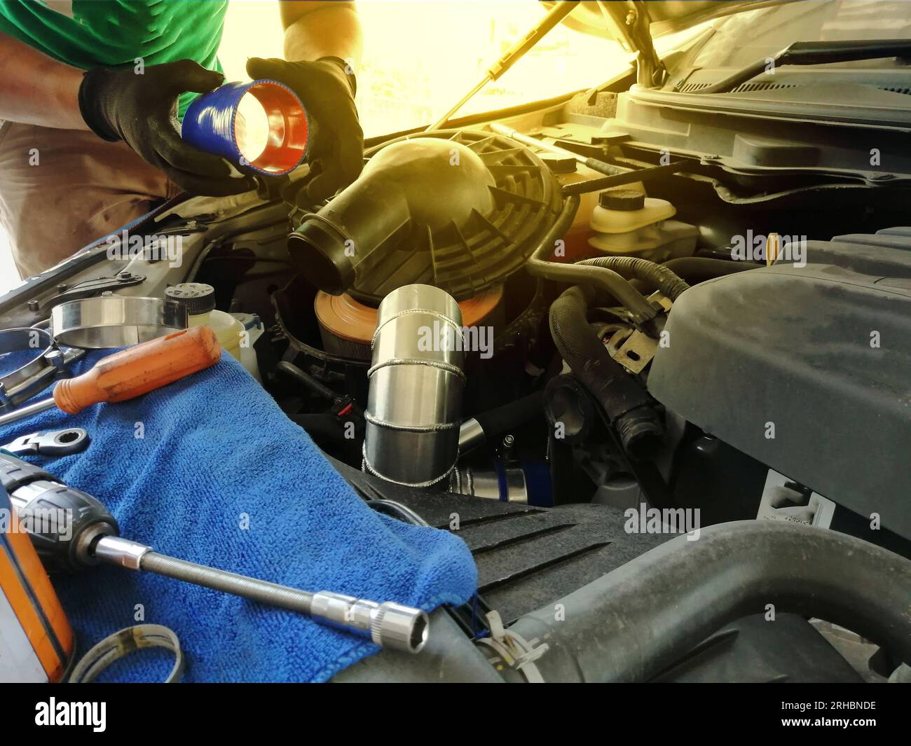 Technician repairing the engine, checking the engine oil change Stock