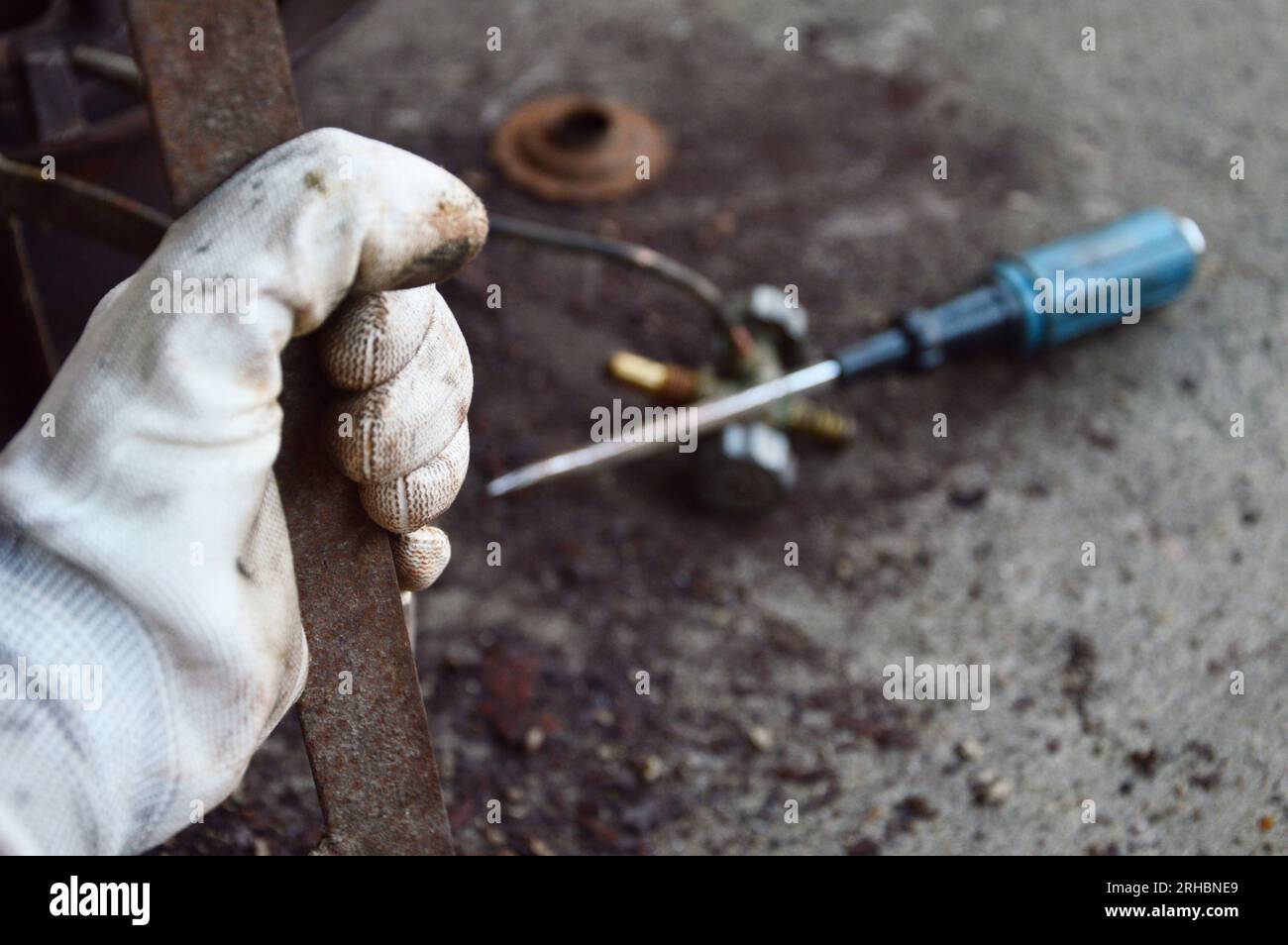 Scrub rusted steel that is stuck. Stock Photo