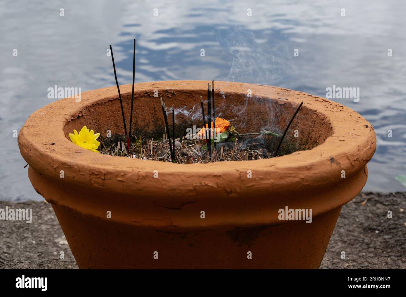 Lighting and smoke from incense sticks during pilgrimage to Ganga Talao