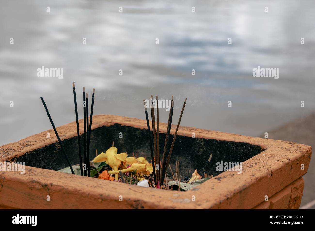 Lighting and smoke from incense sticks during pilgrimage to Ganga Talao
