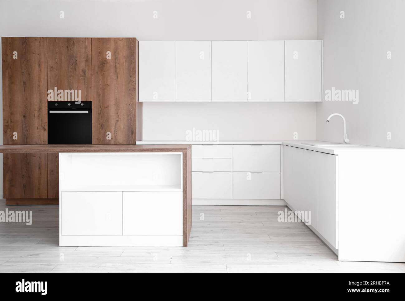 Interior of light kitchen with white counters and built-in oven Stock ...