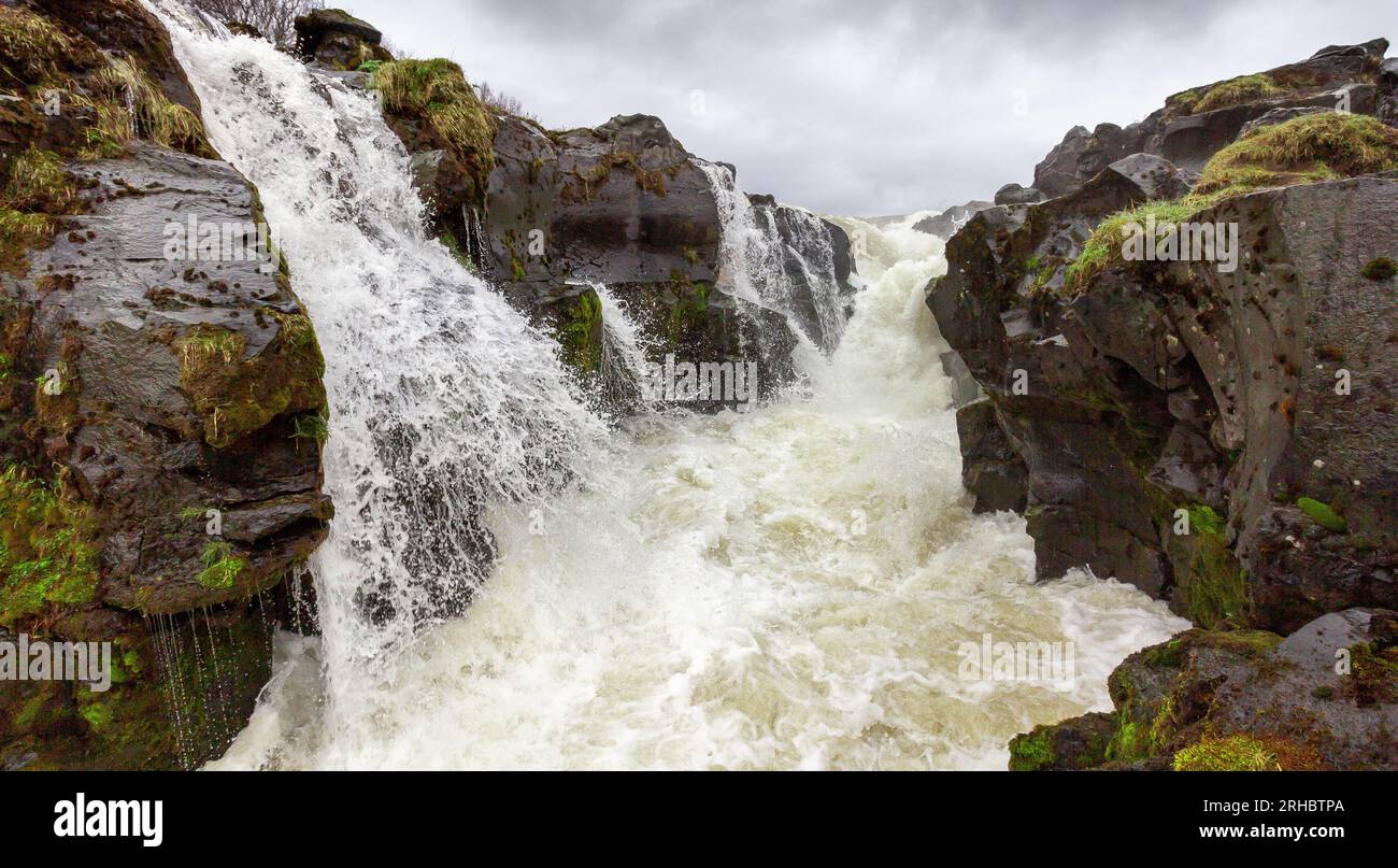 Hlauptungufoss Waterfall on an overcast day, South Iceland, Iceland Stock Photo