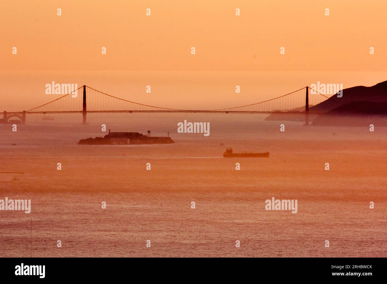 Golden Gate Bridge and Alcatraz viewed from Treasure Island at sunset ...