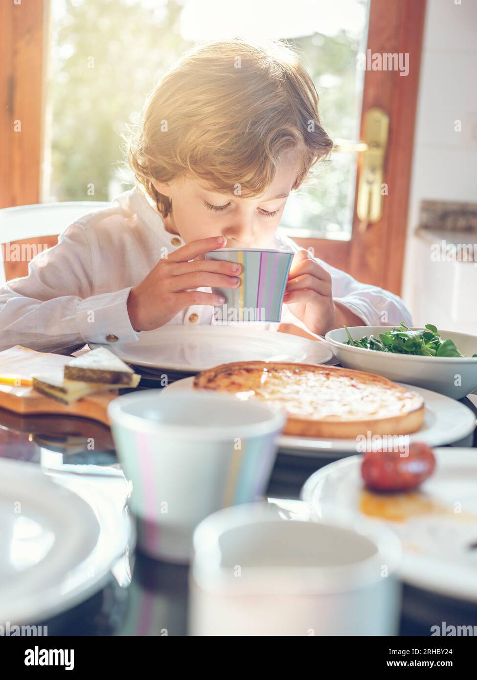 Boy in dining room hi-res stock photography and images - Alamy