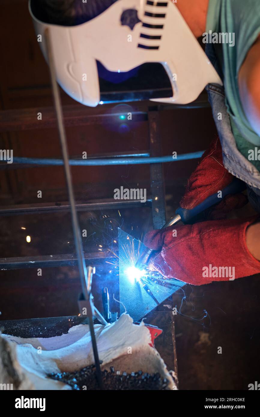 Anonymous worker welding metal factory hi-res stock photography and ...