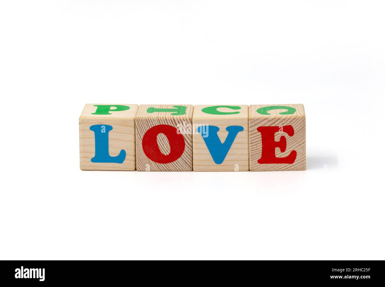Children's wooden cubes with blue, red and green letters with the word love lying side by side. Isolate. High quality photo. Stock Photo
