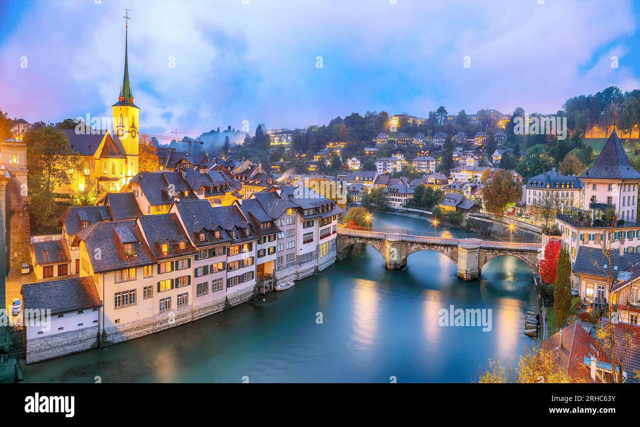 Incredible  autumn view of Bern city at evening. Scene of Aare river with Nydeggkirche - Protestant church. Location: Bern, Canton of Bern, Switzerlan Stock Photo