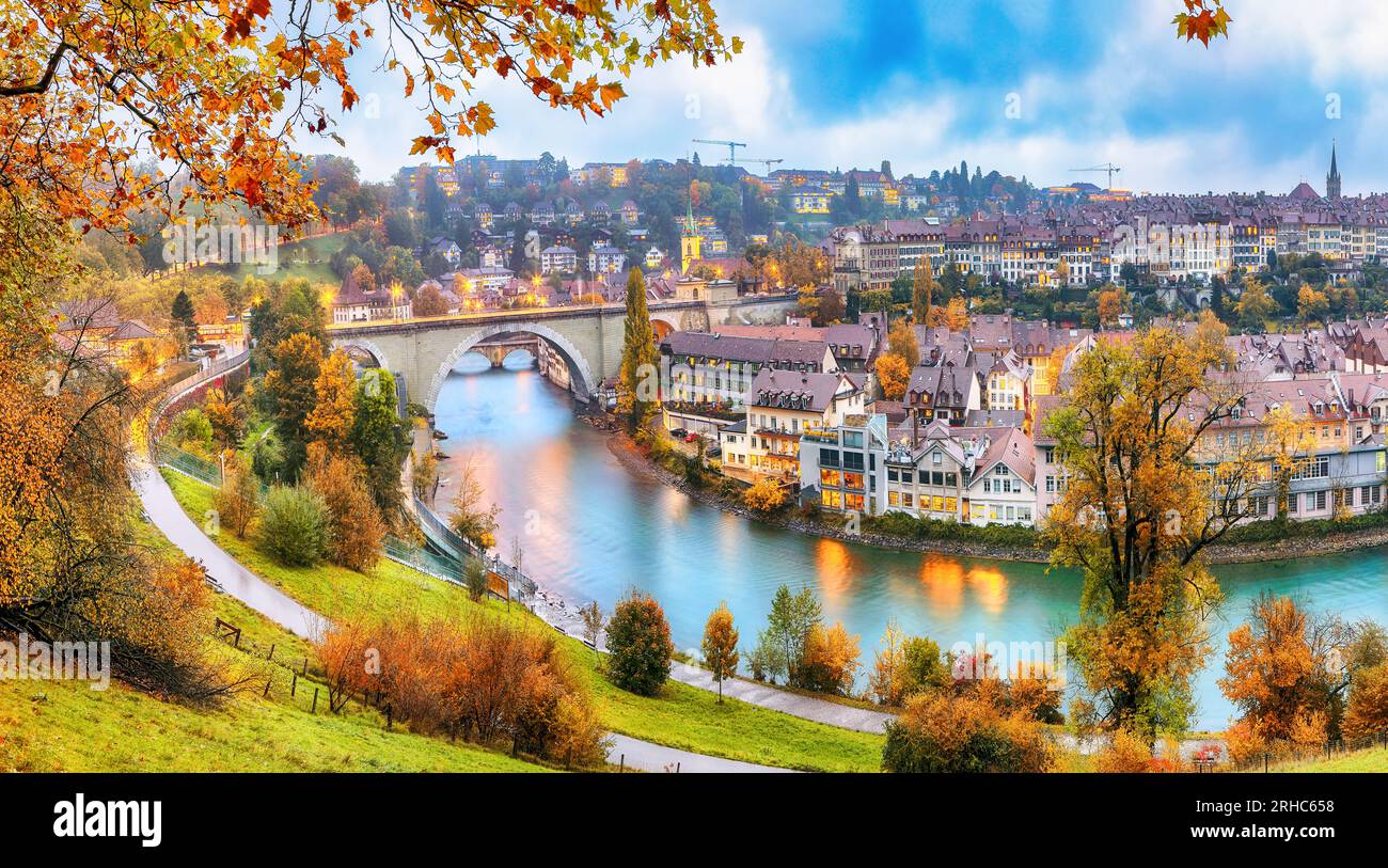 Amazing autumn view of Bern city on  Aare river during evening with Pont de Nydegg bridge and Nydeggkirche - Protestant church. Location: Bern, Canton Stock Photo