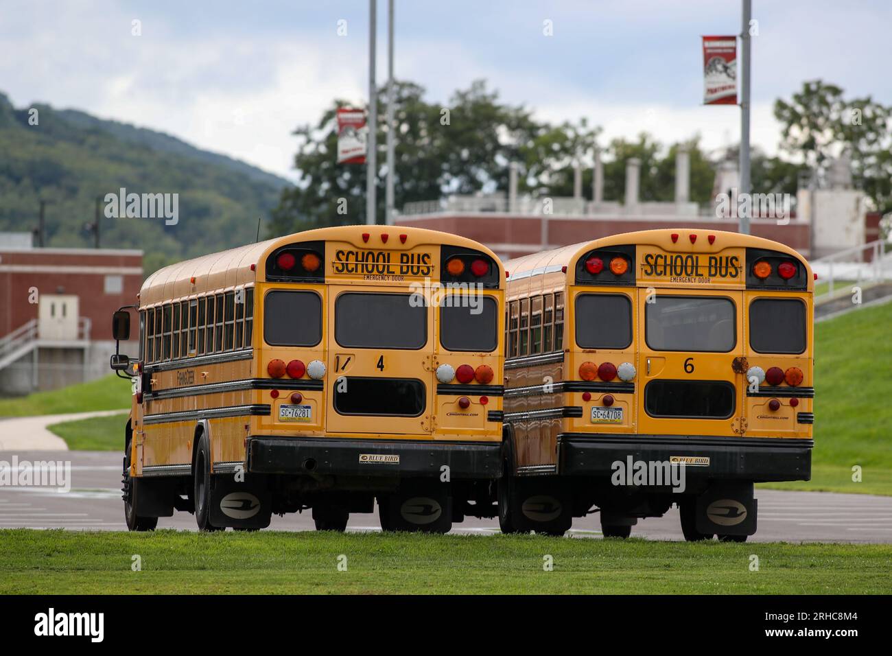 School buses are seen parked at Bloomsburg High School as many school