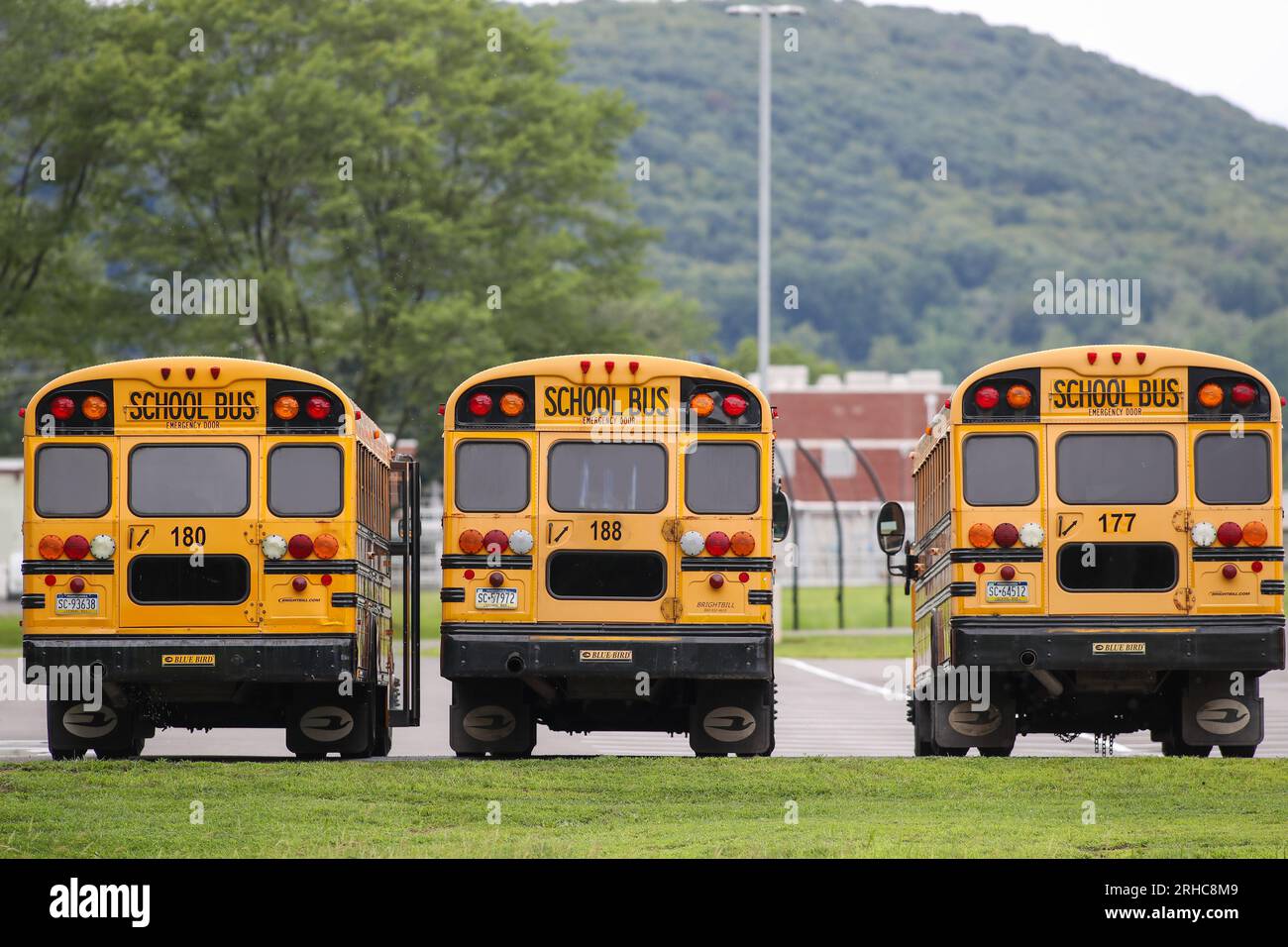 School buses are seen parked at Bloomsburg High School as many school