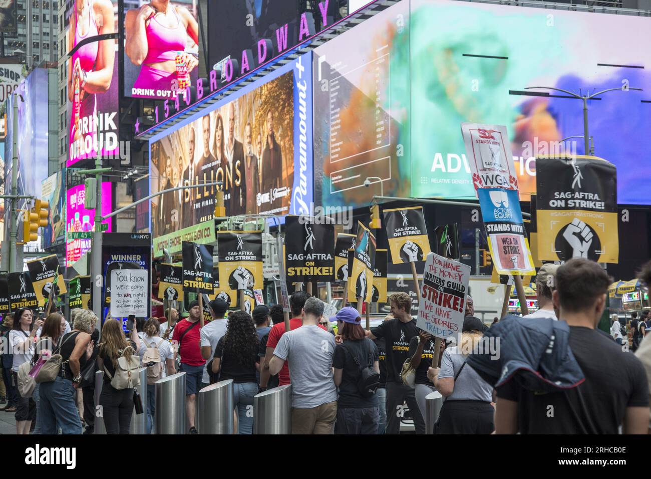 New York City: The strike continues among Writers Guild of America along with SAG-AFTRA  Union members with picket lines in multiple locations  in Manhattan. Union members demonstrate  along Broadway in Times Square, crippling the entertainment industry. Stock Photo