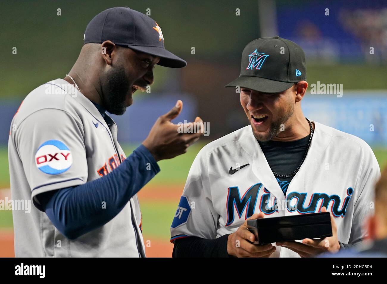 Miami Marlins first baseman Yuli Gurriel, right, is presented with his World  Series ring by former teammate, Houston Astros designated hitter Yordan  Alvarez, before the start of a baseball game between the