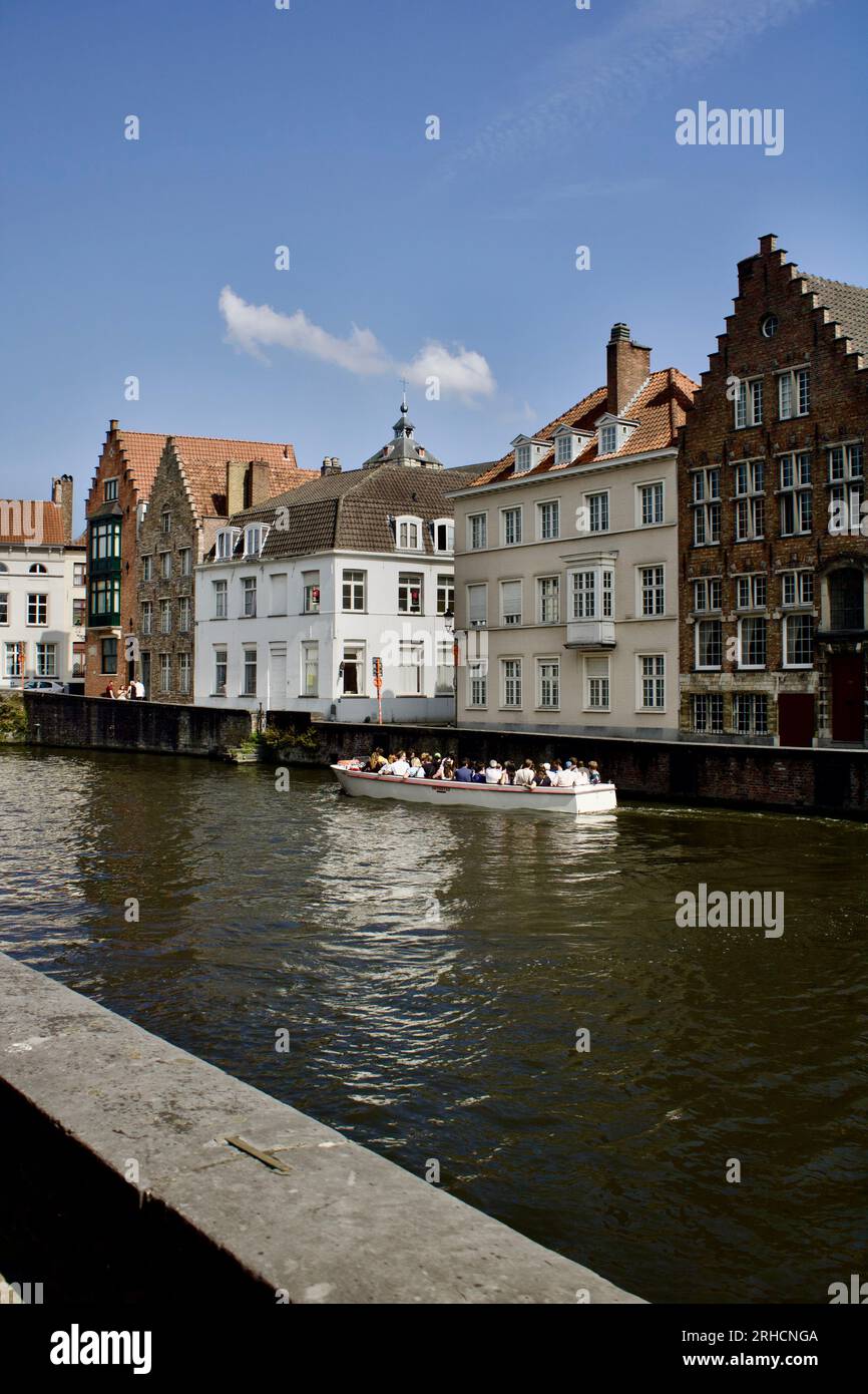 A riverside scene adorned with weathered brick buildings lining the ...