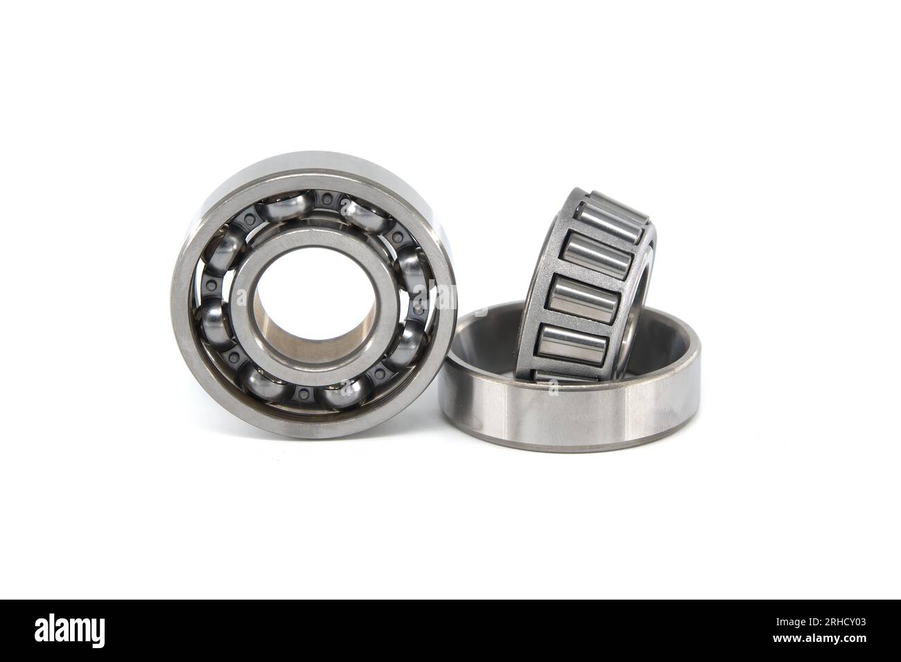 Ball bearing and tapered roller bearing isolated on white background