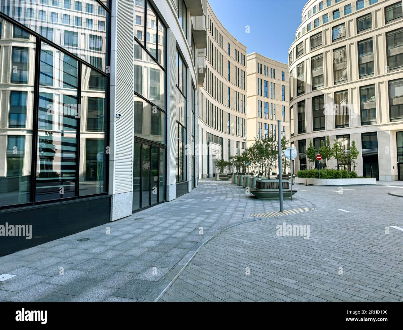 courtyard surrounded by highrise modern office buildings. urban