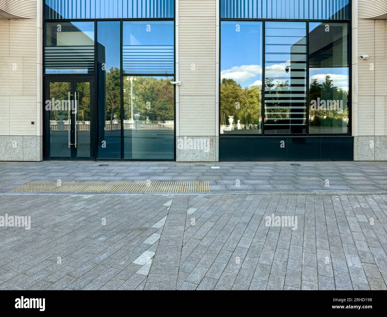 entrance of office building with street reflections. modern urban architecture. Stock Photo