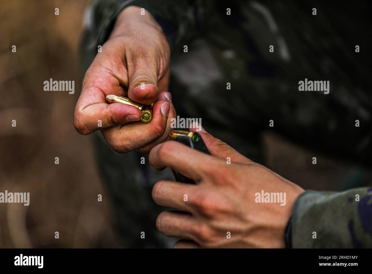 Special forces soldier loads hires stock