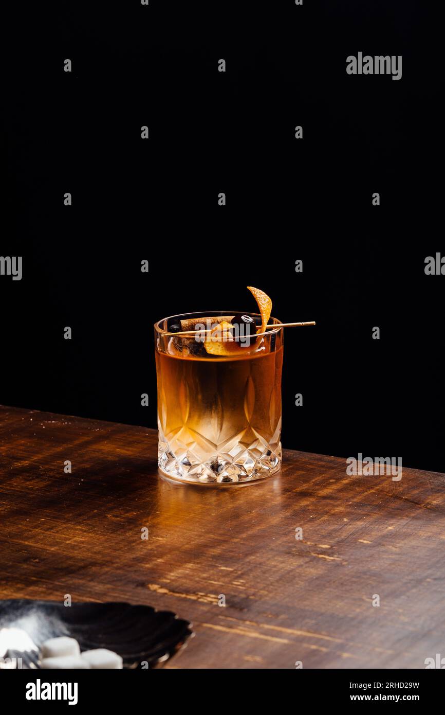 Alcoholic Old Fashioned Cocktail with bourbon whiskey, sugar and
