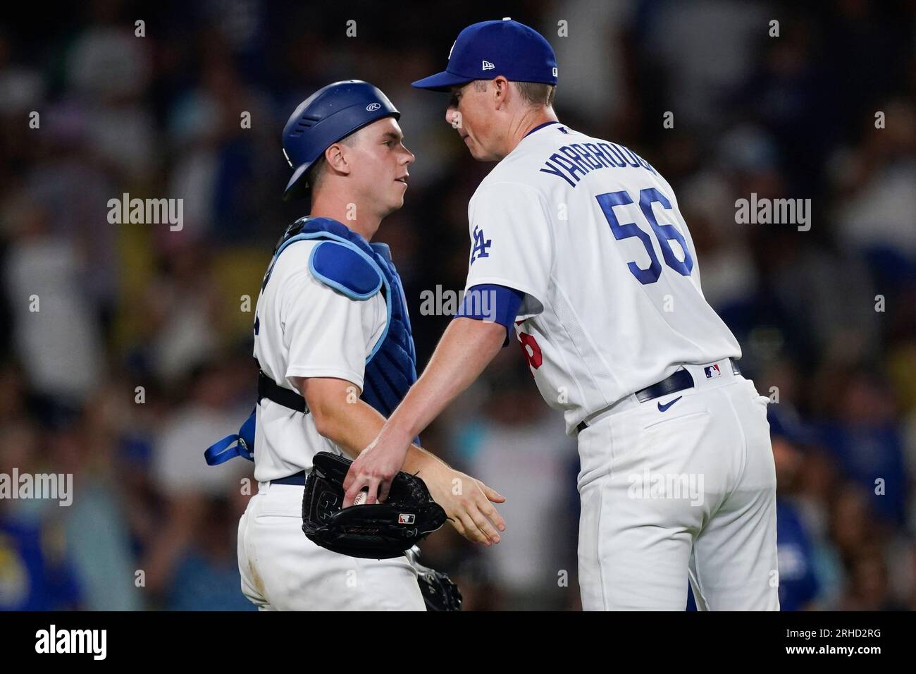 Los Angeles Dodgers relief pitcher Ryan Yarbrough (56) celebrates with catcher Will Smith after