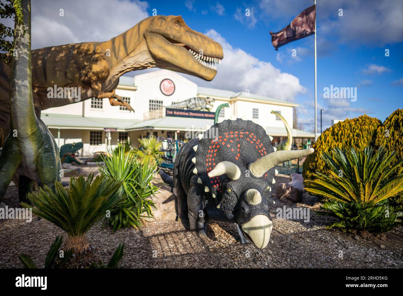 giant plastic dinosaurs status in a park Stock Photo Alamy