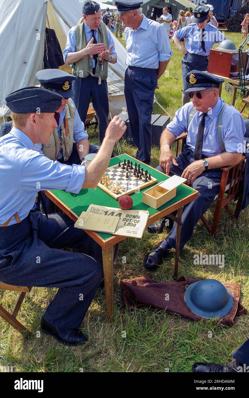 Re-enactment of pilots and trades passing the time on a Second World War airfield during the Battle of Britain, at Biggin Hill, UK. Playing chess Stock Photo