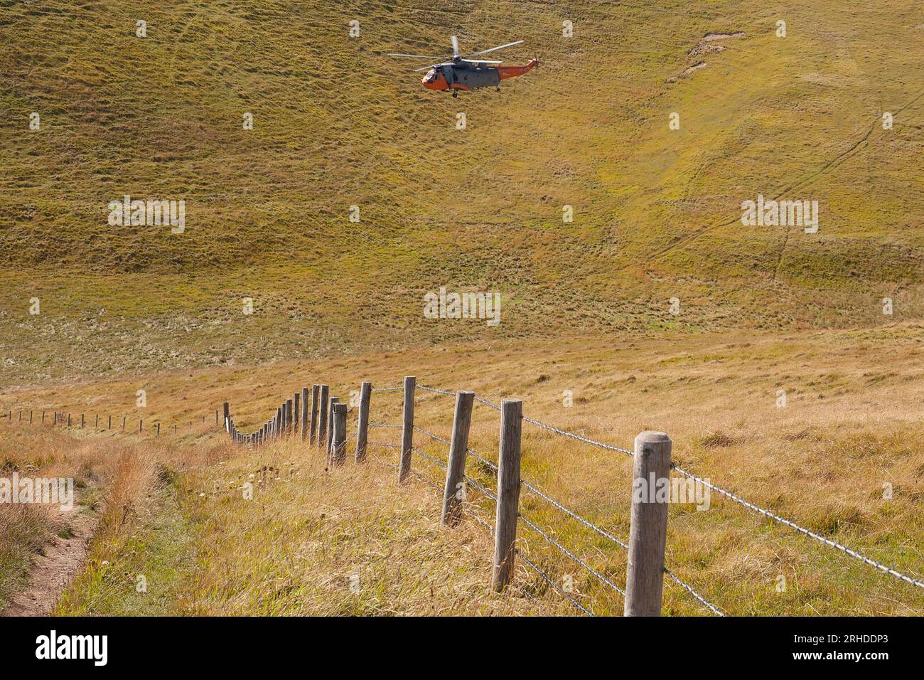 Navy Wings associate aircraft, Sea King XV666 ‘Damian’ flies near Lulworth Stock Photo