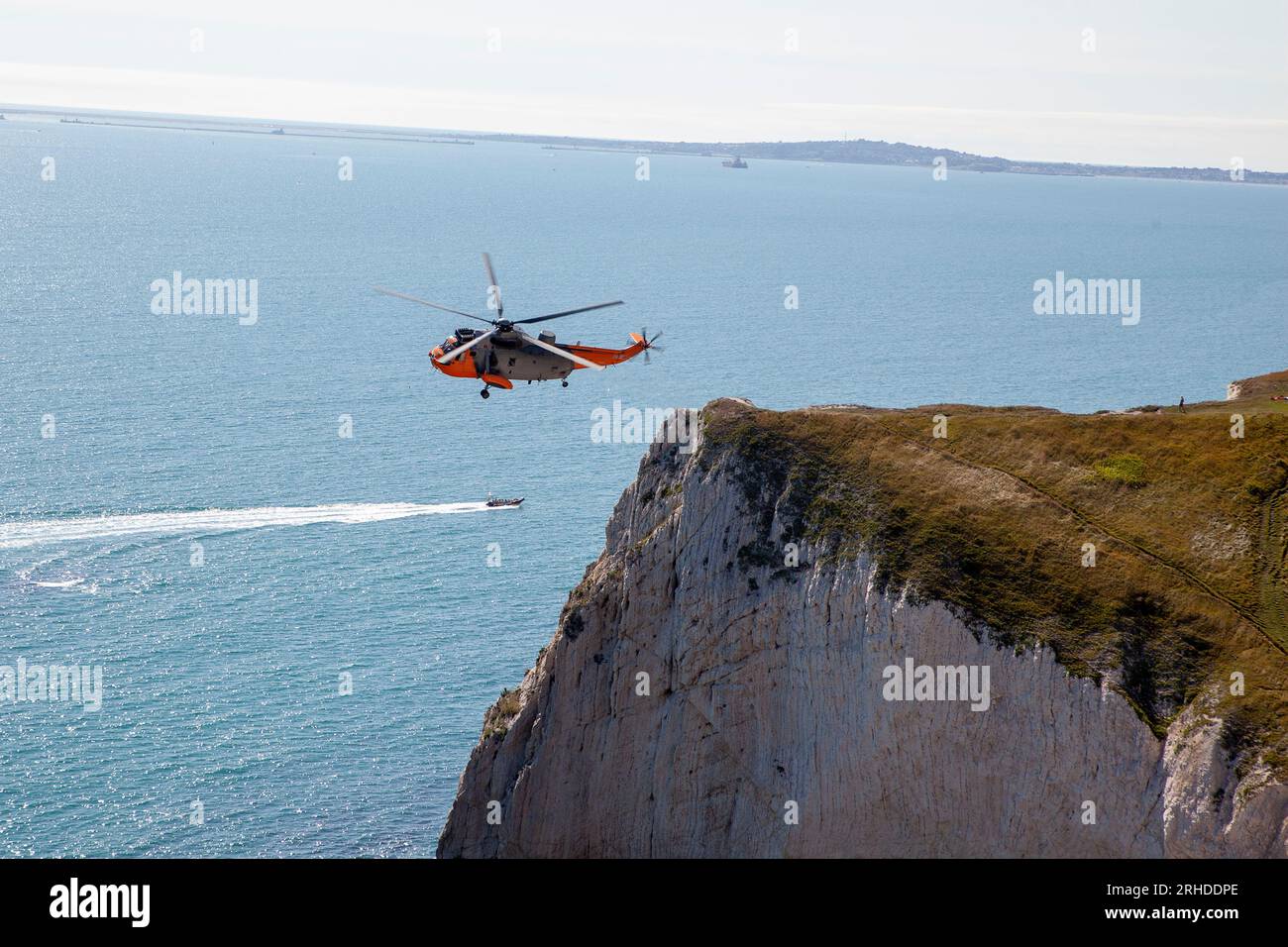 Navy Wings associate aircraft, Sea King XV666 ‘Damian’ flies near Lulworth Stock Photo
