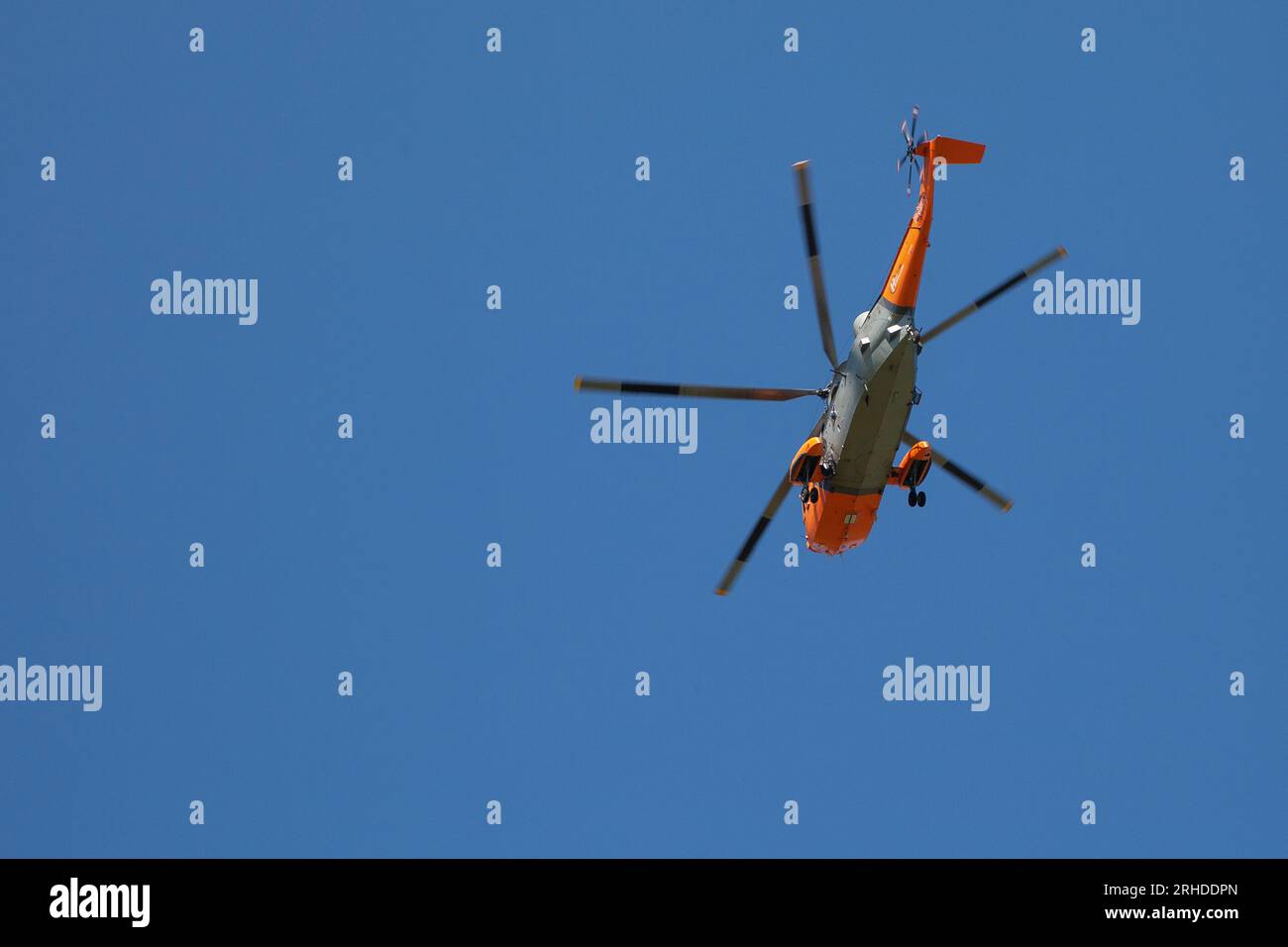 Navy Wings associate aircraft, Sea King XV666 ‘Damian’ flies near Lulworth Stock Photo