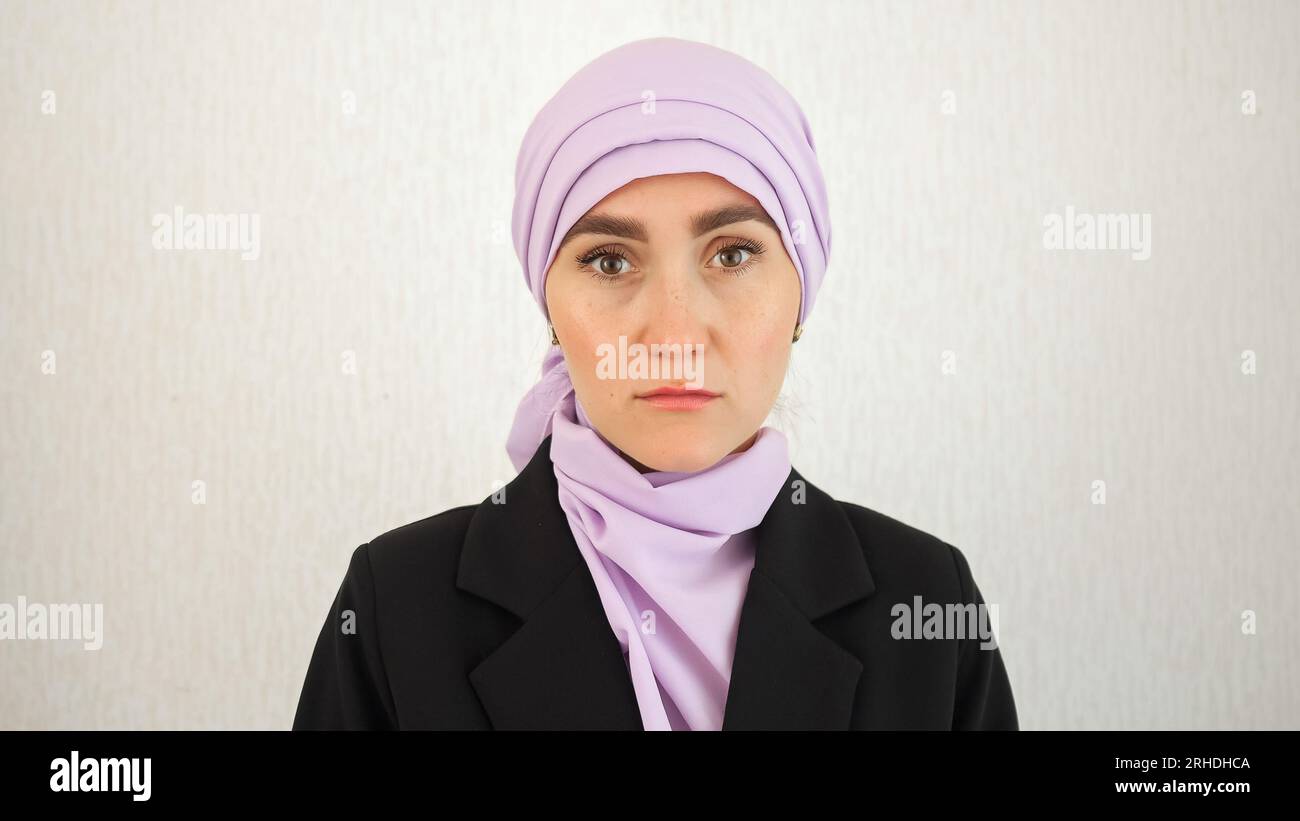 Woman in hijab looks hi-res stock photography and images - Alamy