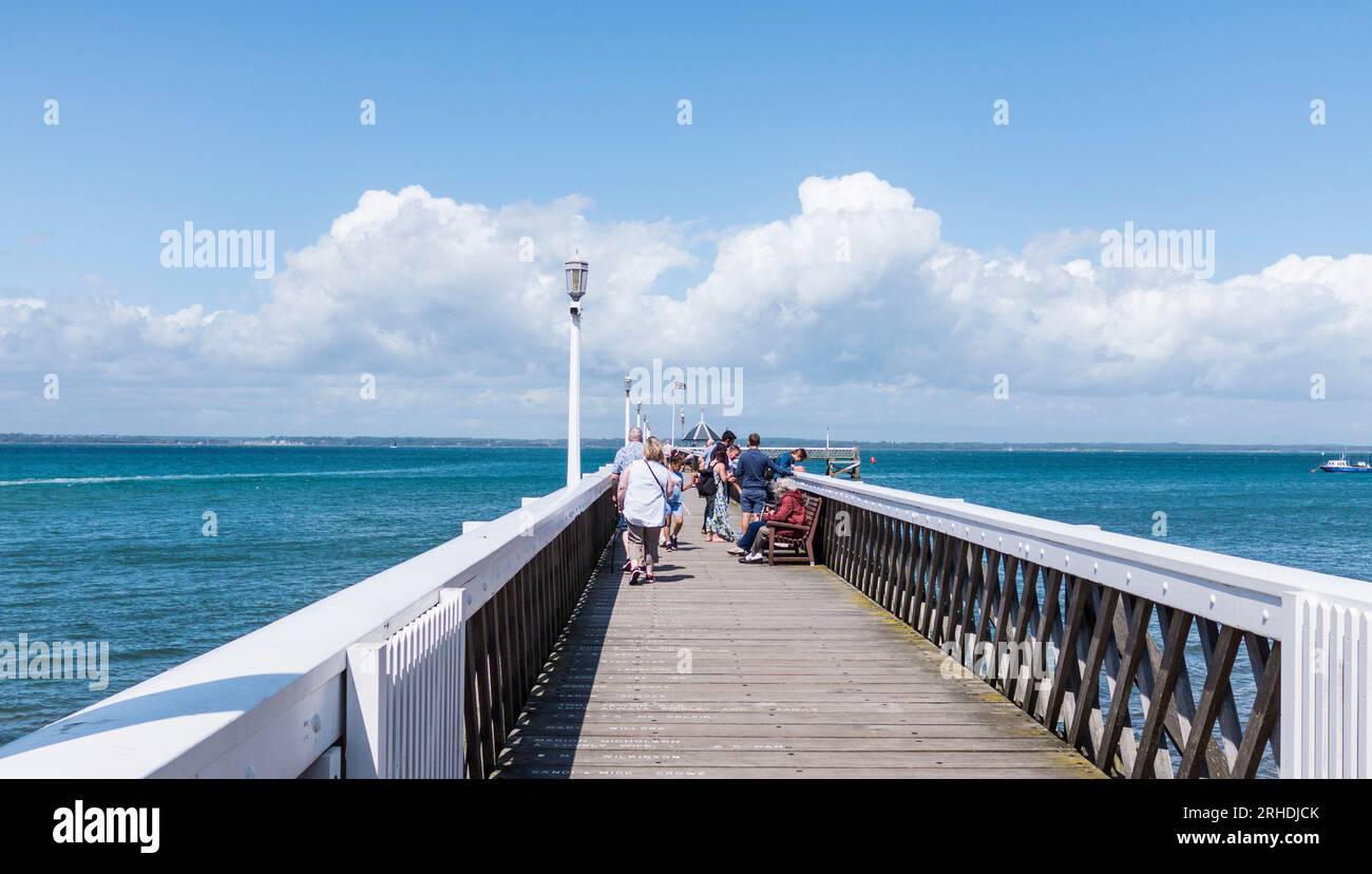 People walking along the pier at Yarmouth,Isle of Wight, England,UK Stock Photo