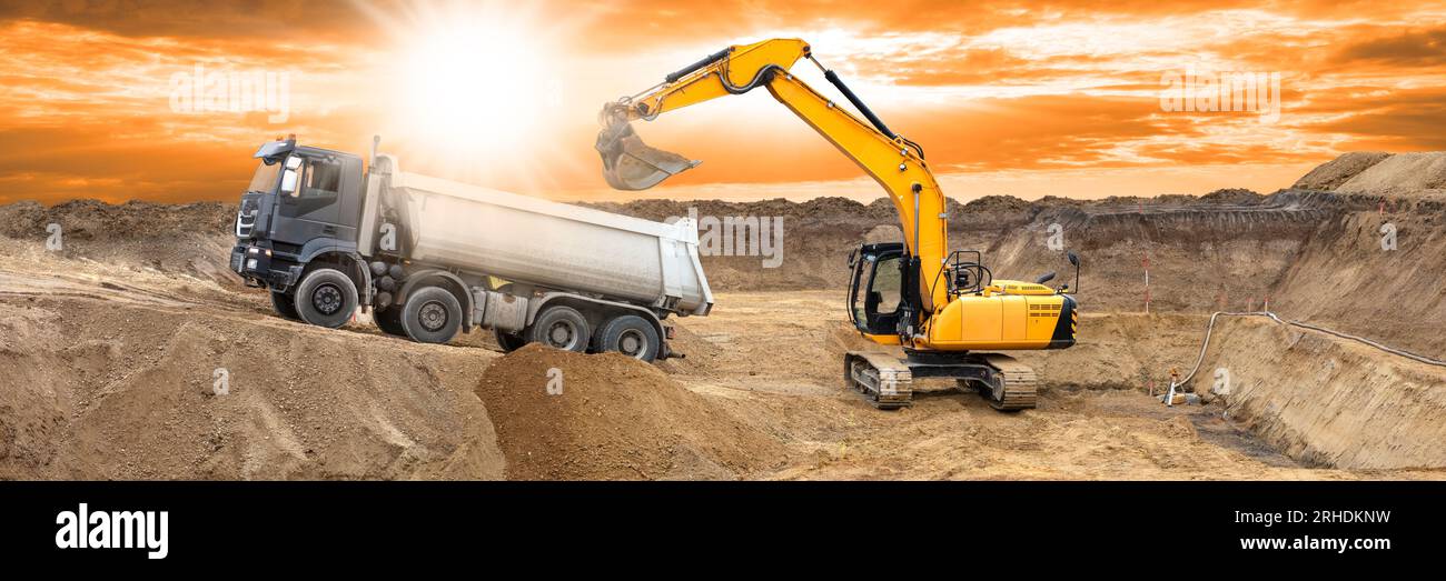 Excavator loading soil in truck hi-res stock photography and images - Alamy