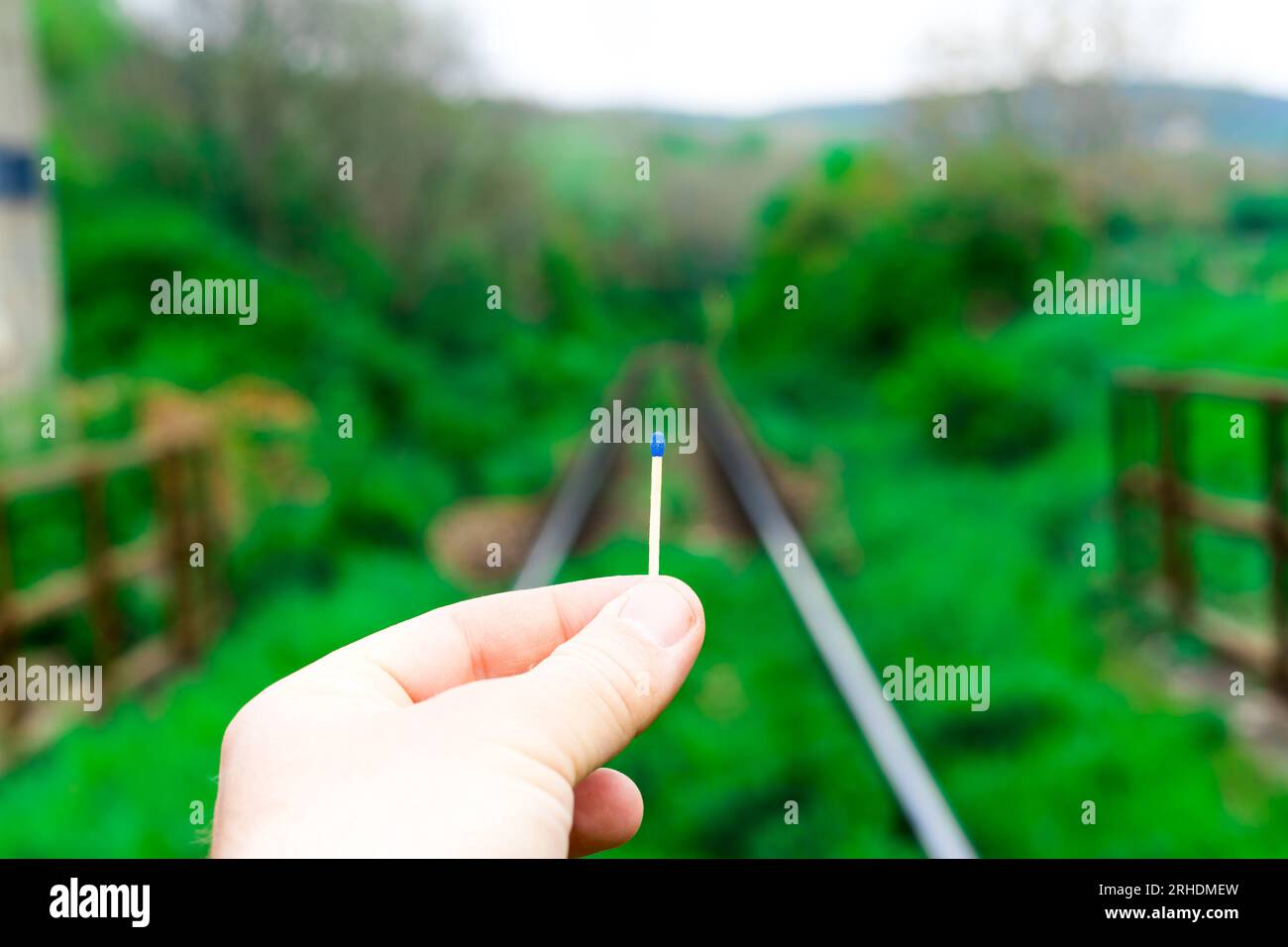 Matches on rails railroad tracks background, fire on railways concept