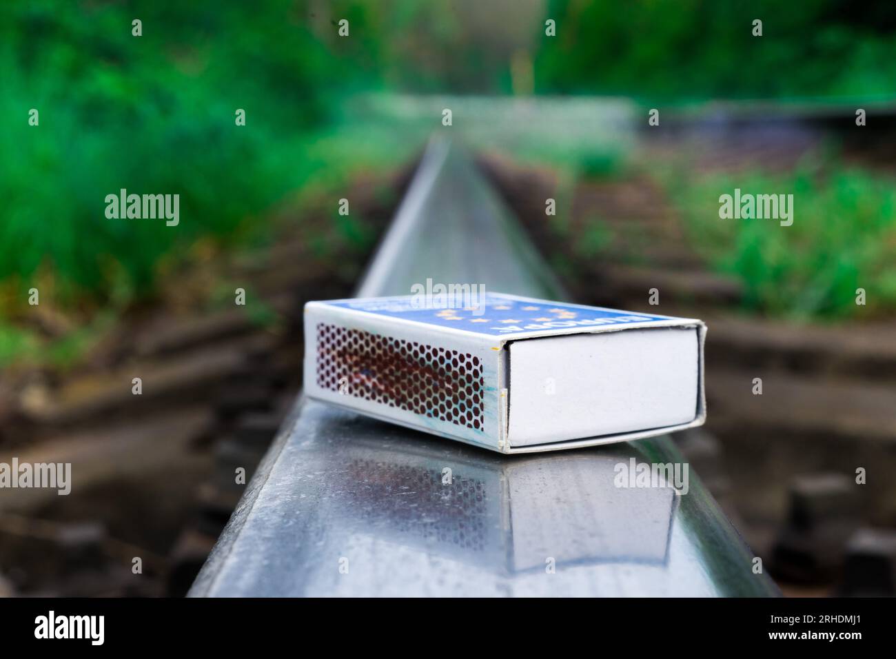 Matches on rails railroad tracks background, fire on railways concept