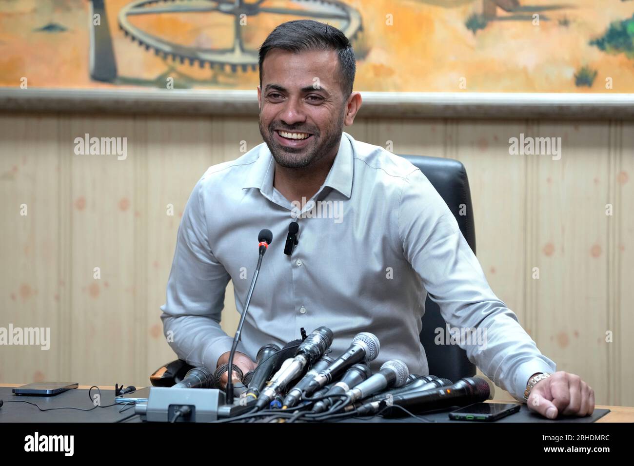 Pakistan fast bowler Wahab Riaz smiles during a press conference, in ...