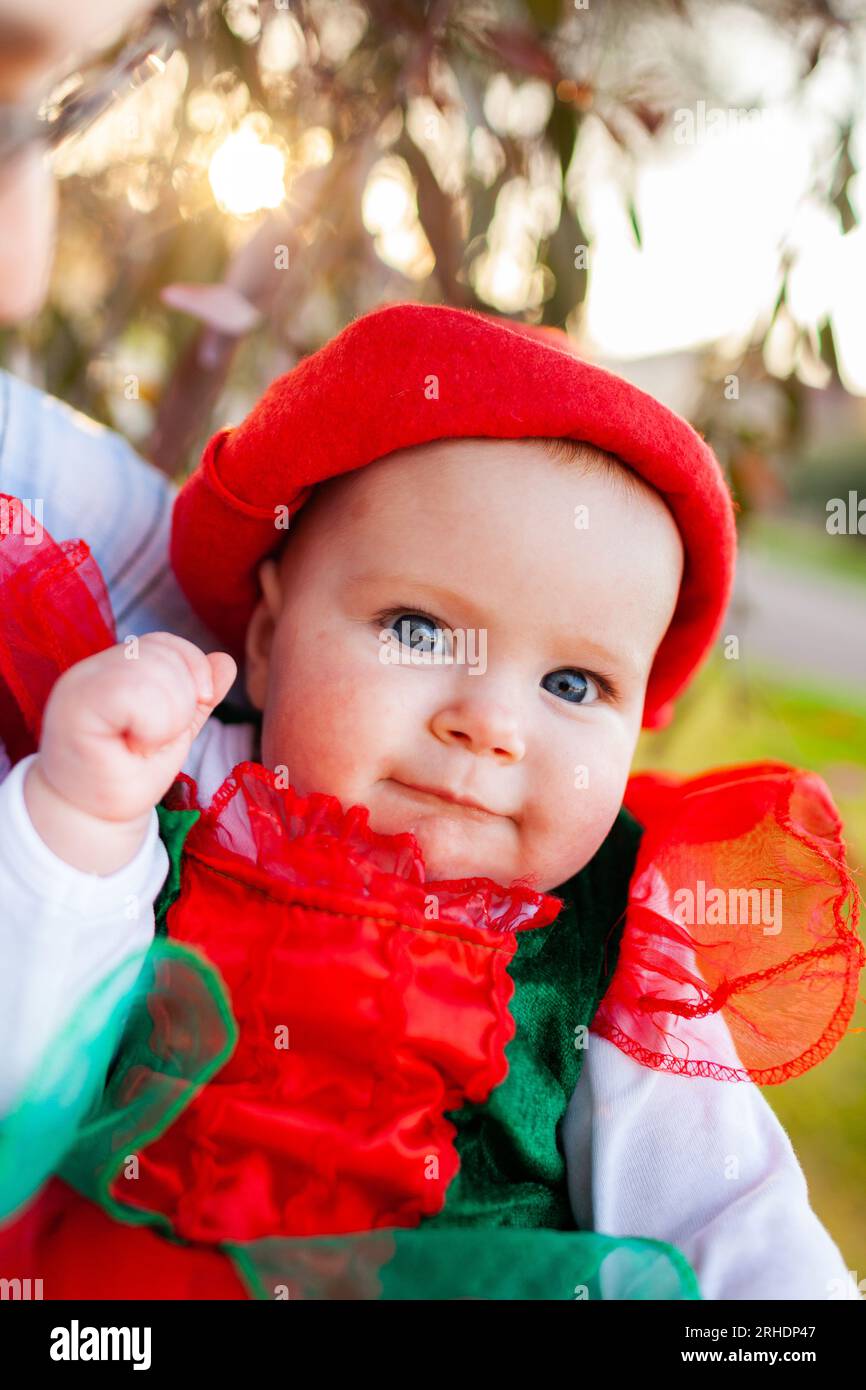 Australian baby girl in christmas clothes outside Stock Photo