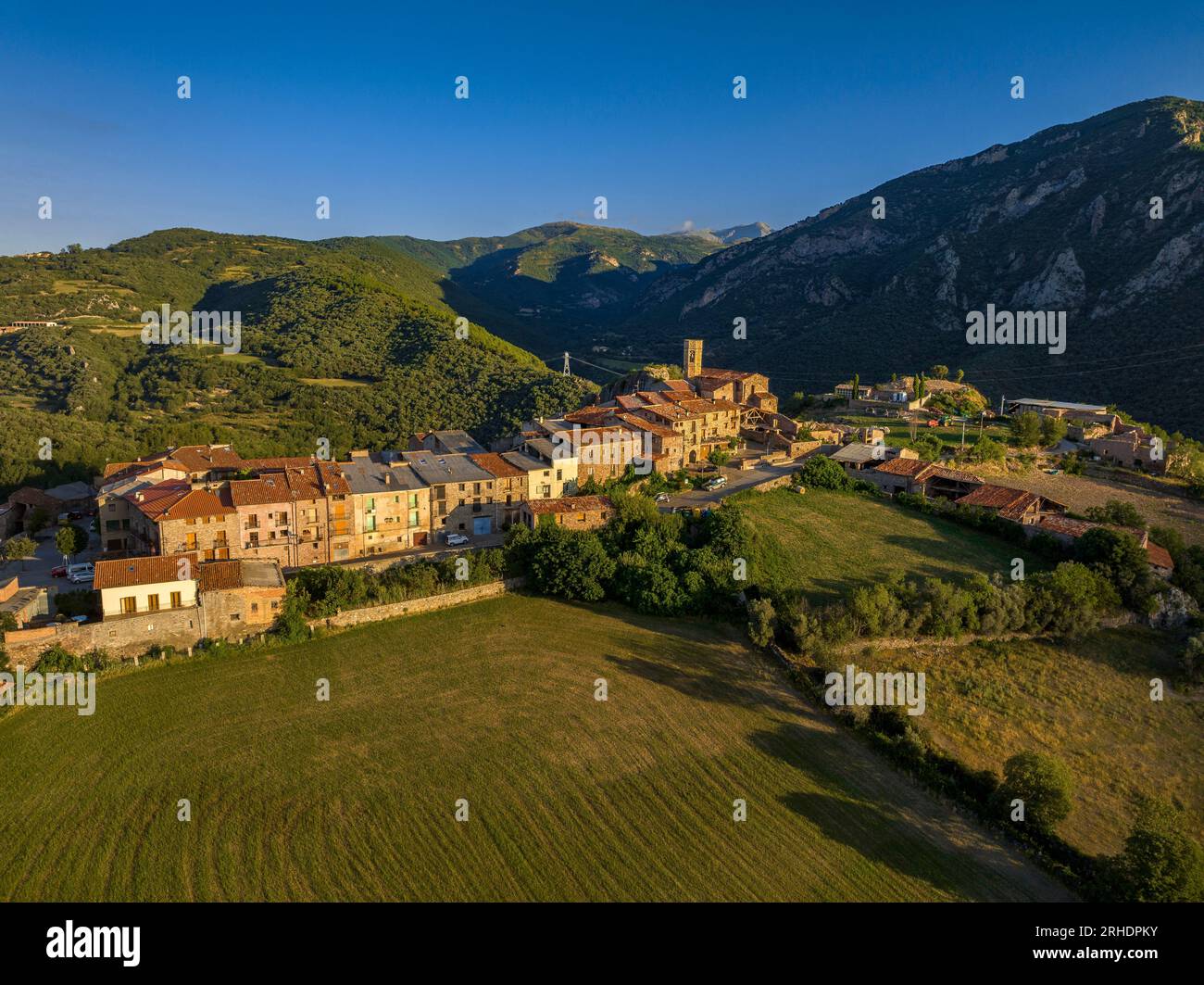 Aerial view of the town of Peramea in a summer sunrise (Pallars Sobirà, Lleida, Catalonia, Spain, Pyrenees) ESP: Vista aérea del pueblo de Peramea Stock Photo