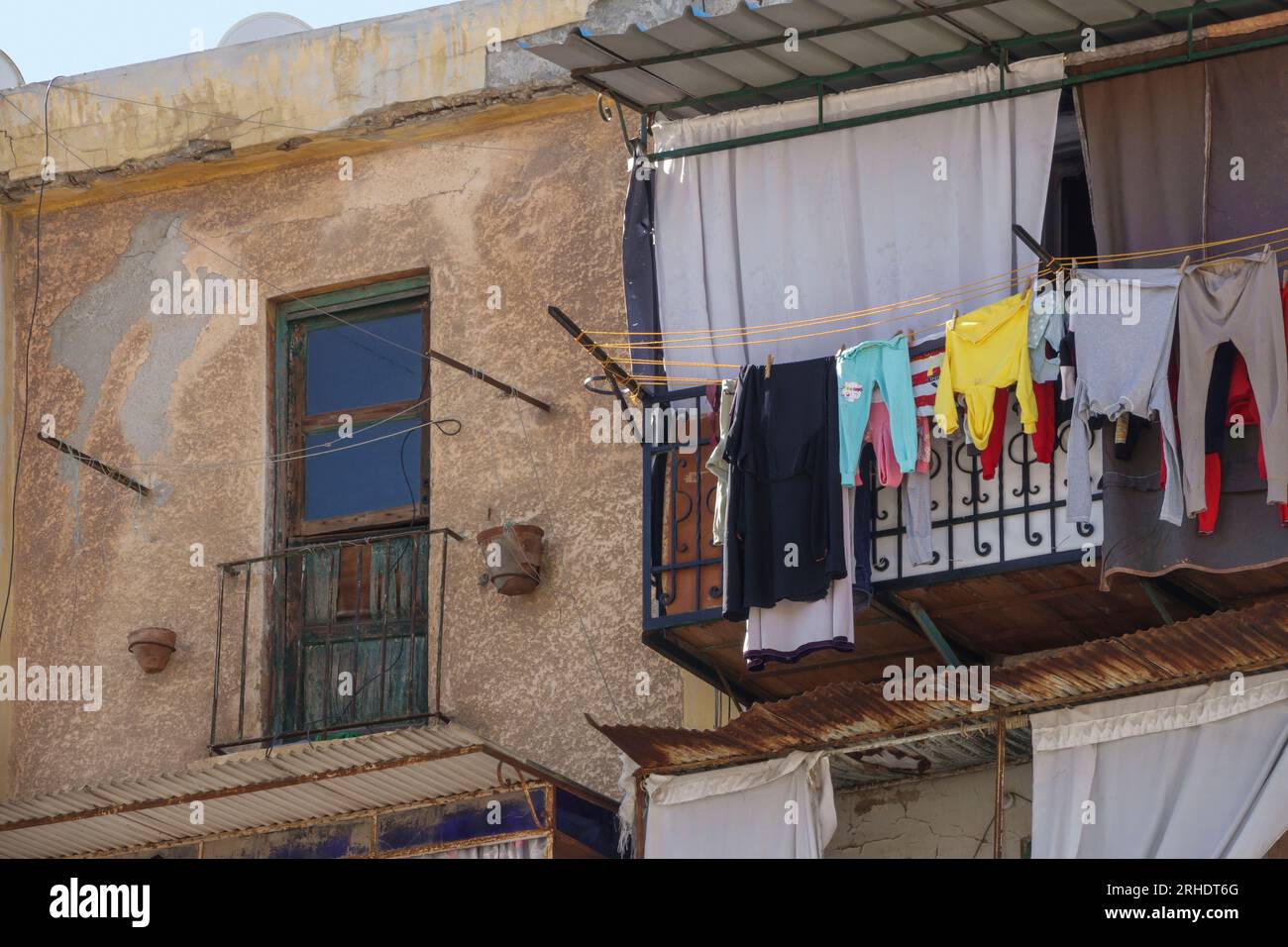 Washing drying on balconies in apartment blocks in Alexandria, Egypt Stock Photo