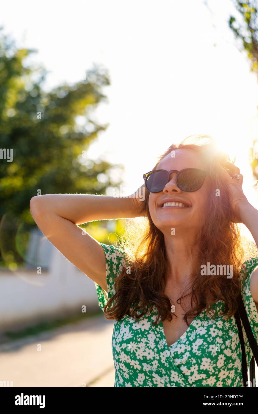 Woman in sunglasses enjoying hi-res stock photography and images - Alamy