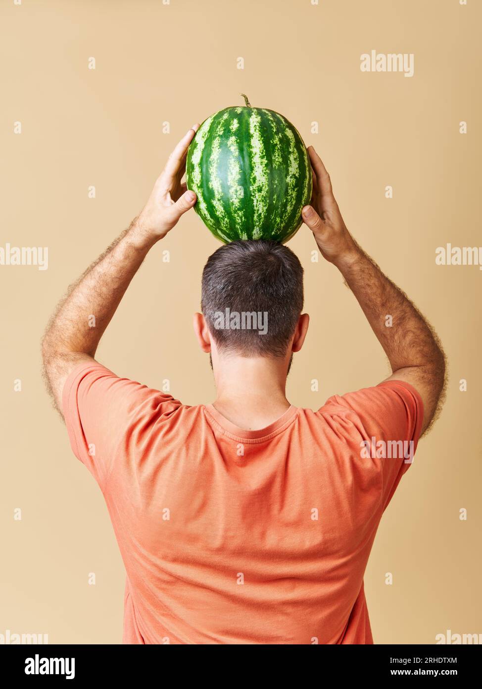 Melon head man holding melon hires stock photography and images Alamy