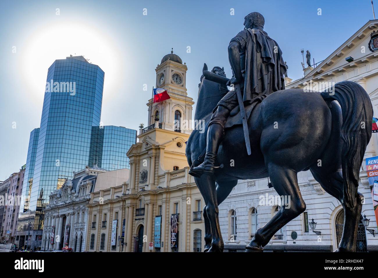 The equestrian statue of Don Pedro de Valdivia in the Plaza de Armas De San Fernando, Santiago, Chile.  Behind is the Palacio de la Real Audiencia de Stock Photo