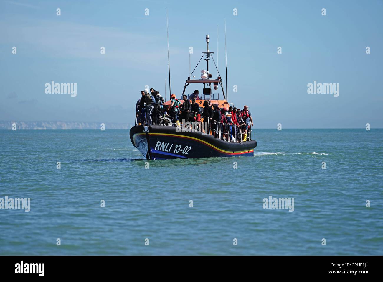 A group of people thought to be migrants are brought in to dungeness, kent,  onboard the rnli dungeness lifeboat, following a small boat incident in the  channel. hi-res stock photography and images -