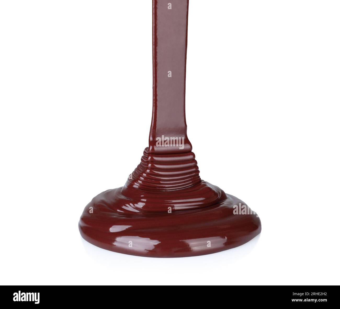 Melted chocolate dripping on white background close-up Stock Photo