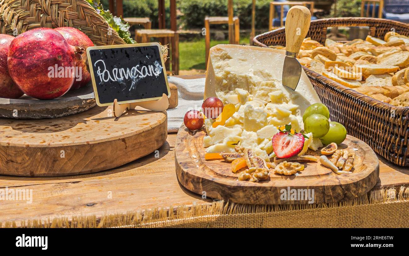 free cheese buffet on wooden boards and with decorations for an event and professionally presented Stock Photo