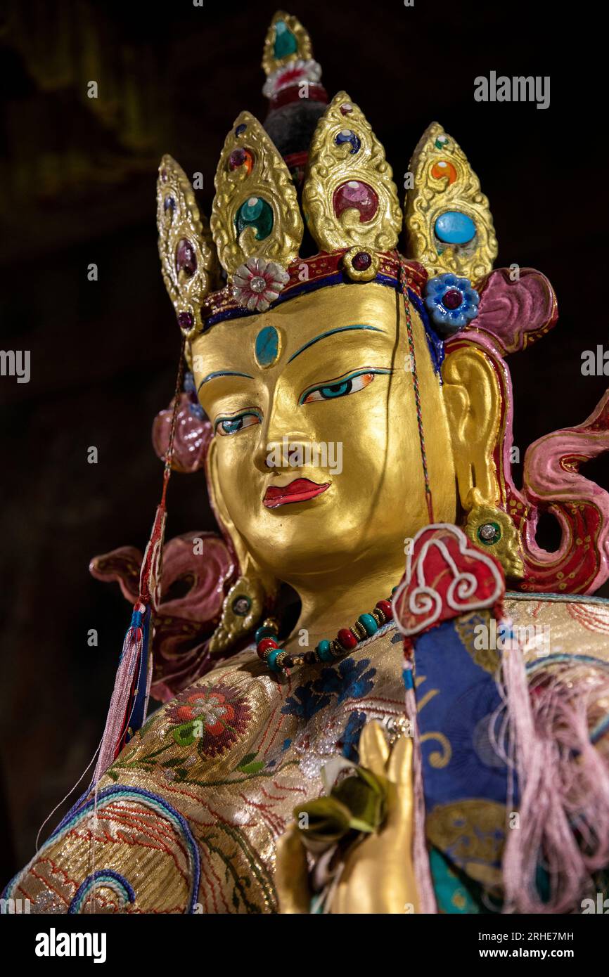 India, Ladakh, Leh Valley, Thiksey Gompa, Manjusri, personifying supreme wisdom statue in rock-carved cave temple Stock Photo