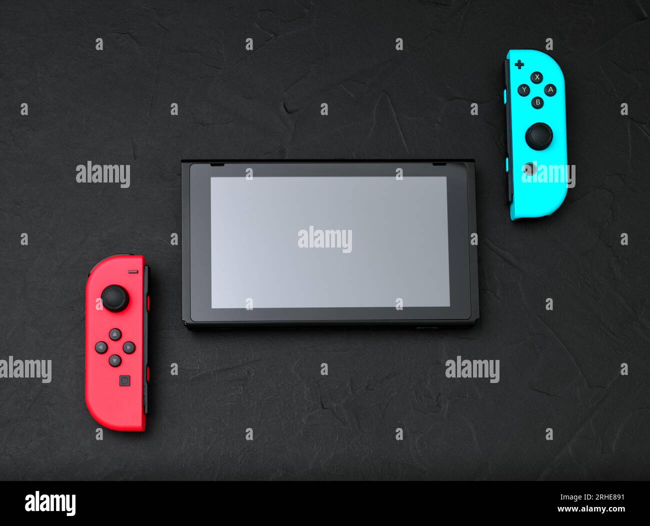 Kiev, Ukraine - September 07, 2022: Nintendo Switch game console on black concrete background. Nintendo Switch is a hybrid video game console develope Stock Photo