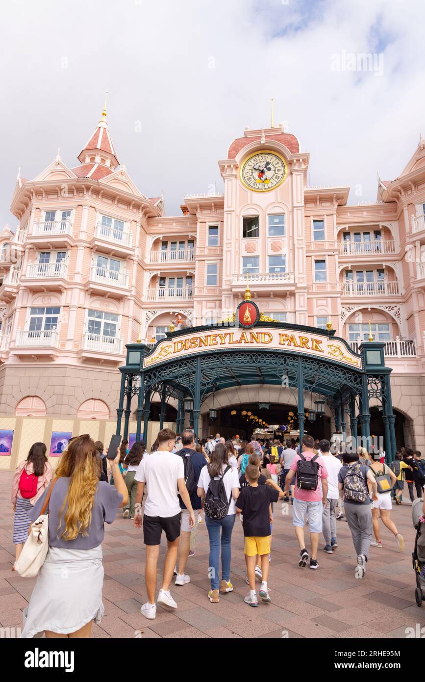 People at the entrance to Disneyland Paris which is through the Disneyland Hotel, Disney, Paris France Stock Photo